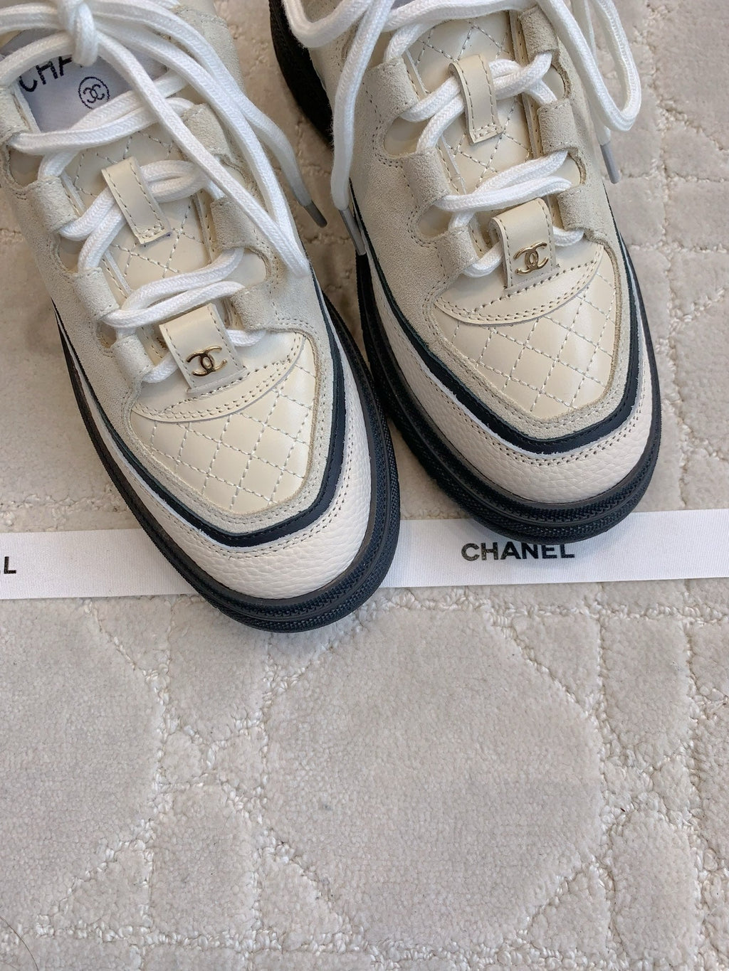 CHANEL 25S TRAINERS 40MM IN WHITE AND BLACK CALFSKIN
